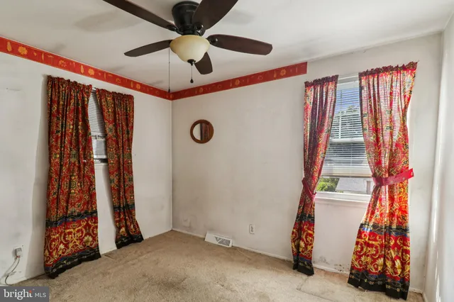 a view of a house with a yard and a garden