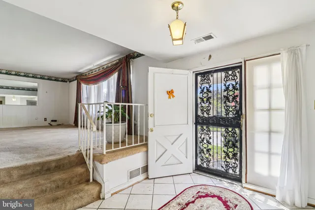 a kitchen with stainless steel appliances granite countertop a stove and a refrigerator