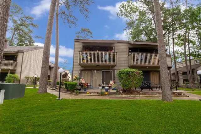 a front view of a building with garden