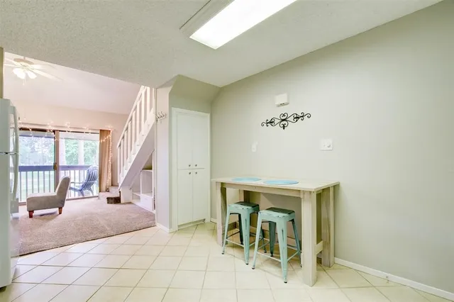 a view of a livingroom with furniture and windows