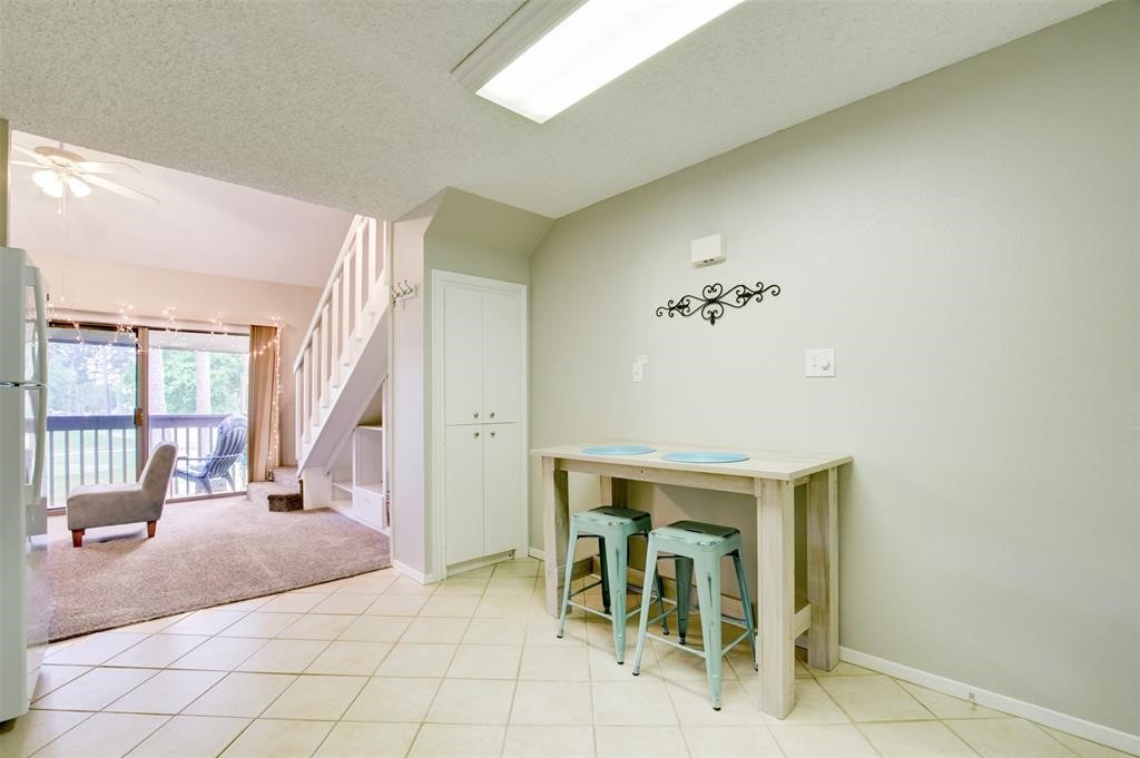 12900 Walden Road, Unit 202B Montgomery, TX 77356 - Photo 14 of 30 a view of a livingroom with furniture and windows