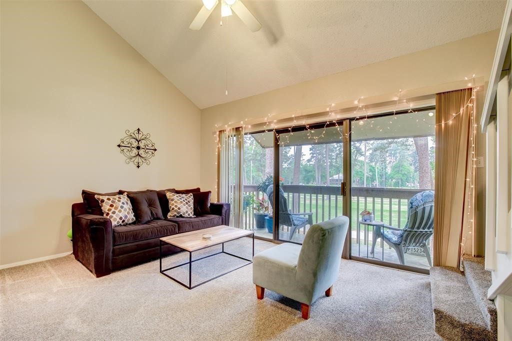 12900 Walden Road, Unit 202B Montgomery, TX 77356 - Photo 3 of 30 a living room with furniture and a large window