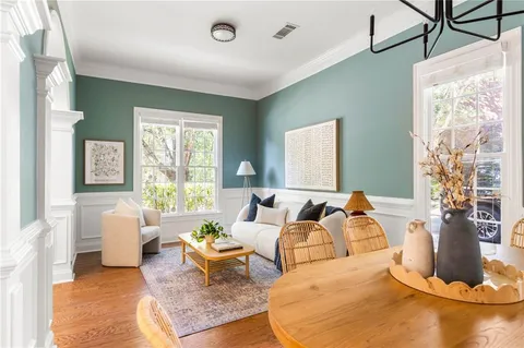 a living room with furniture rug and window