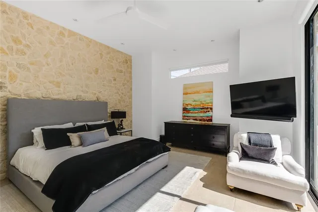 a bedroom with a bed and a couch