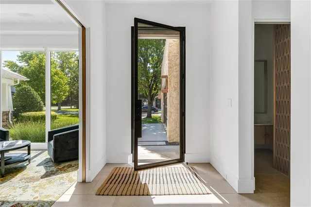a view of a room that has a bed and a window