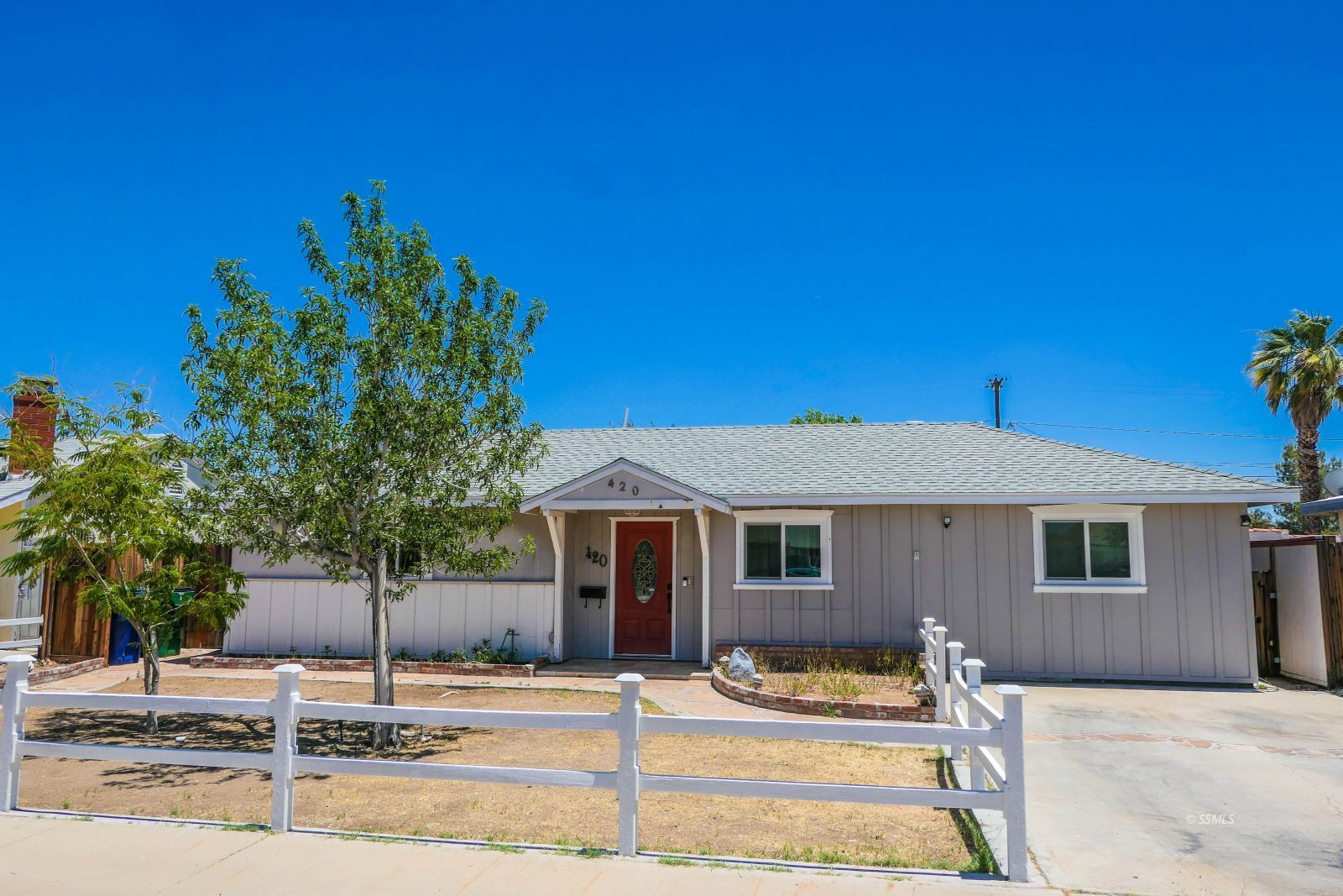 420 North Fairview Street Ridgecrest, CA 93555 - Photo 1 of 48 a front view of a house with garden