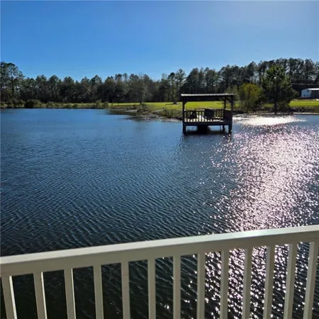 a view of swimming pool with lake view