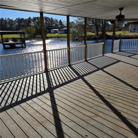 a view of a balcony with wooden floor