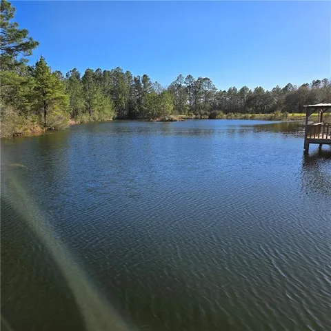 a view of a lake with mountain in the background