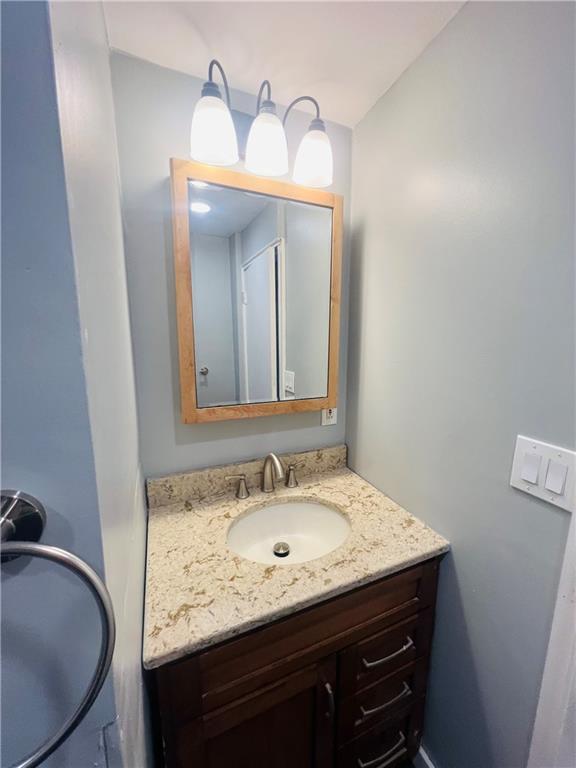 262 Adams Street Pittsburgh, PA 15221 - Photo 20 of 26 a bathroom with a granite countertop sink and a mirror