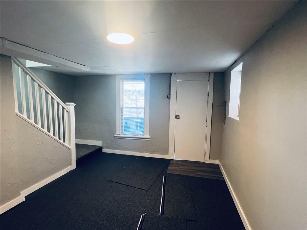 262 Adams Street Pittsburgh, PA 15221 - Photo 21 of 26 an empty room with wooden floor and windows