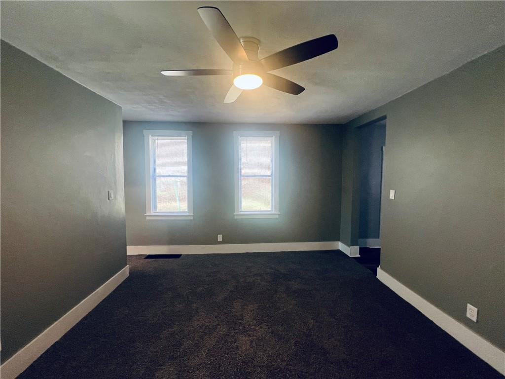 262 Adams Street Pittsburgh, PA 15221 - Photo 6 of 26 an empty room with wooden floor and windows