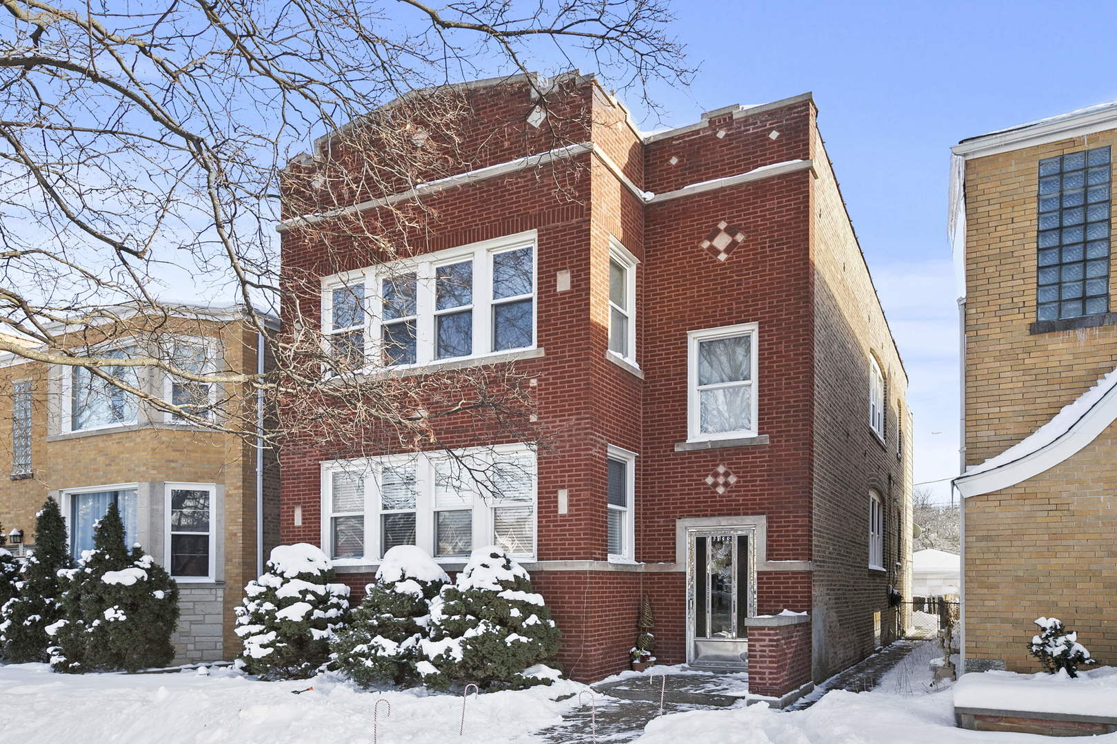 a view of a building with a lot of flower plants