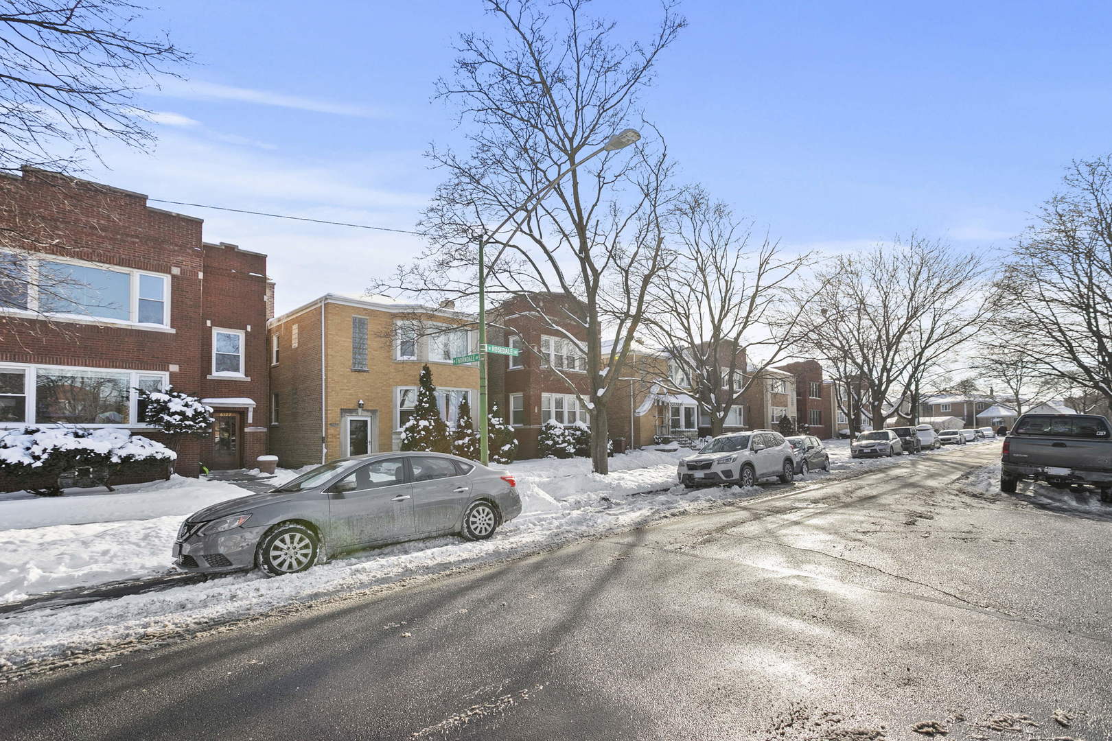 6133 West Rosedale Avenue Chicago, IL 60646 - Photo 11 of 11 a view of parking with cars parked