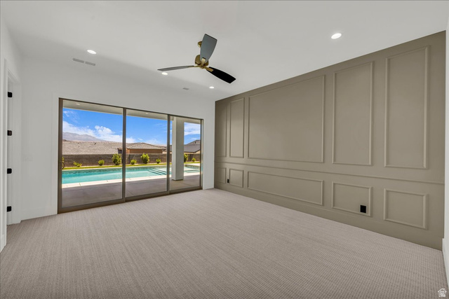 1620 Belayer Drive St. George, UT 84770 - Photo 21 of 51 Spacious room featuring broadloom carpeting, a full wall of decorative panel molding, and recessed lighting