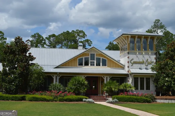 a front view of house with garden