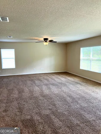 an empty room with a windows