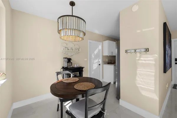 a view of a livingroom with furniture and a window