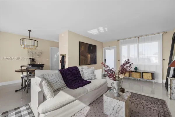 a living room with furniture and a table