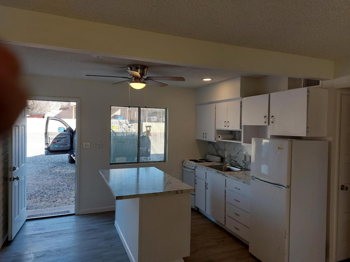 4140 East Cliffside Trail, Unit G Rimrock, AZ 86335 - Photo 7 of 25 a kitchen with kitchen island granite countertop a sink cabinets and stainless steel appliances