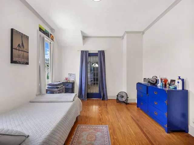 a bed room with a bed and with furniture