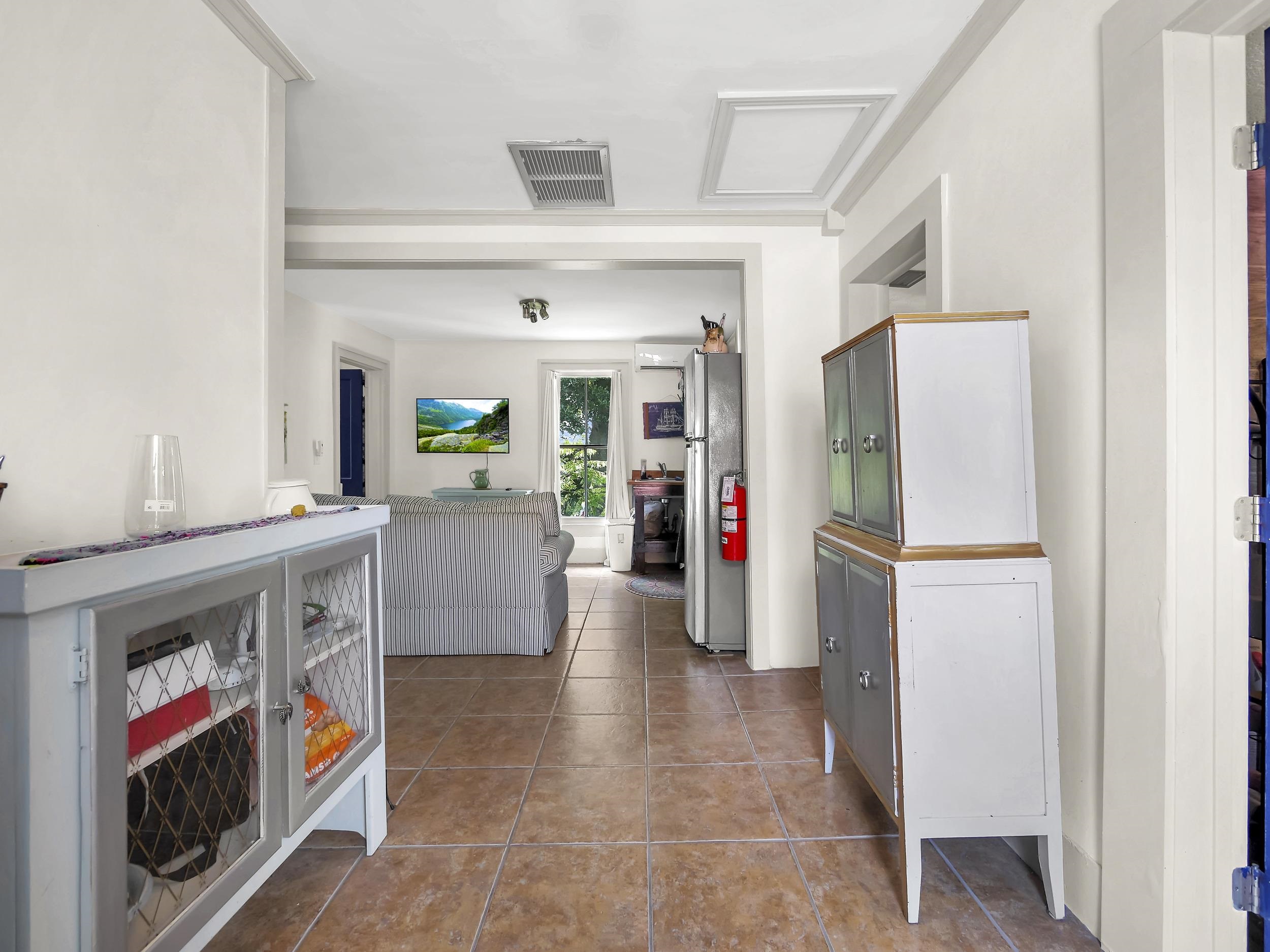 8 Davis Street St. Augustine, FL 32084 - Photo 21 of 36 a living room with furniture and a flat screen tv