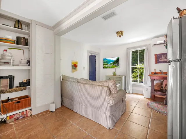 a bed room with furniture and a window