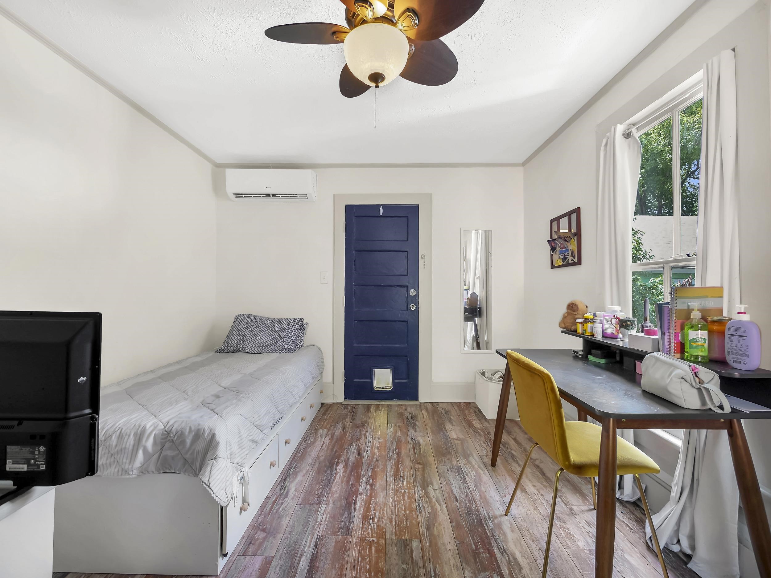 8 Davis Street St. Augustine, FL 32084 - Photo 29 of 36 a bedroom with furniture and a wooden floor