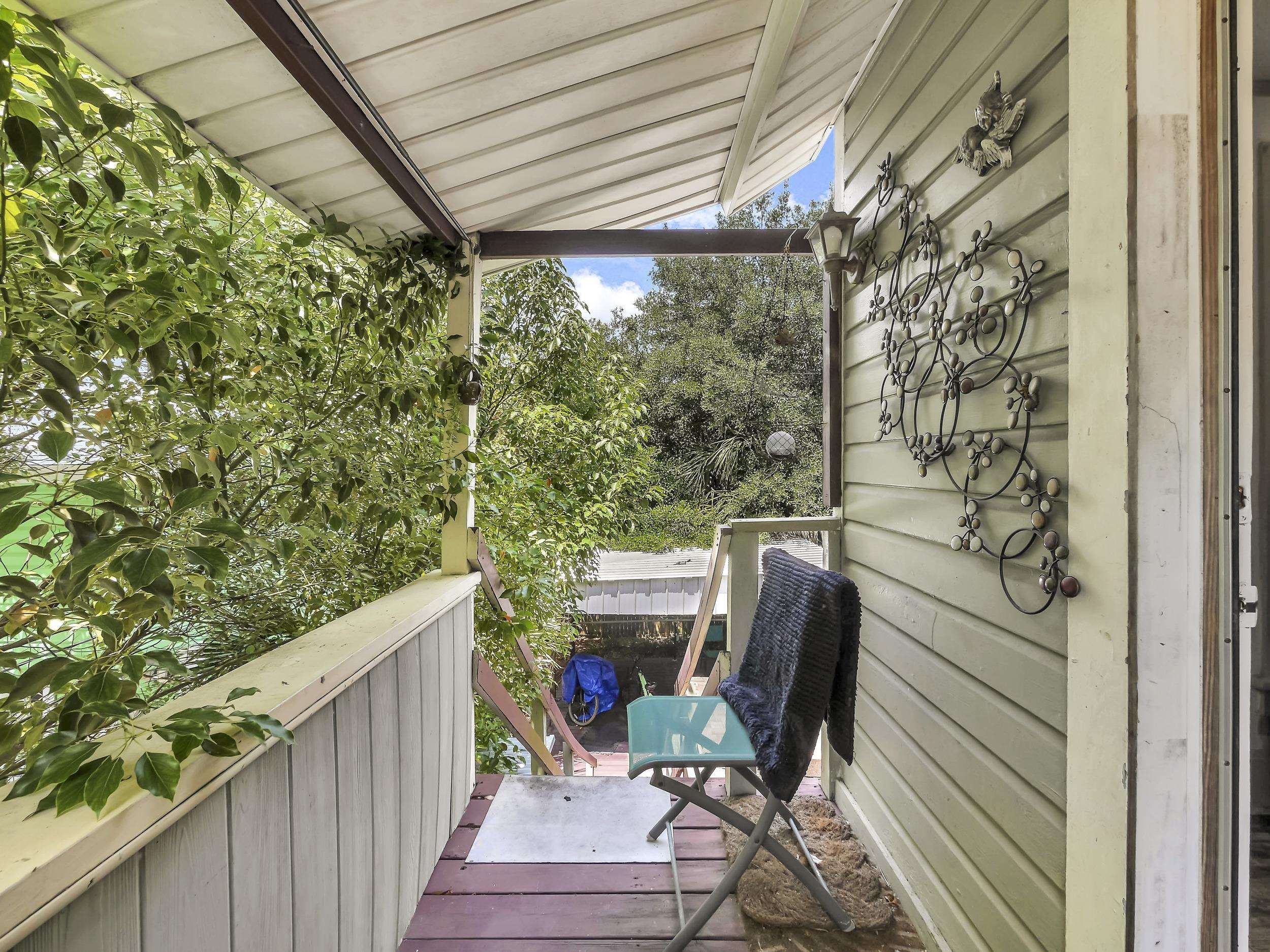 8 Davis Street St. Augustine, FL 32084 - Photo 32 of 36 a view of a chair and table in the balcony
