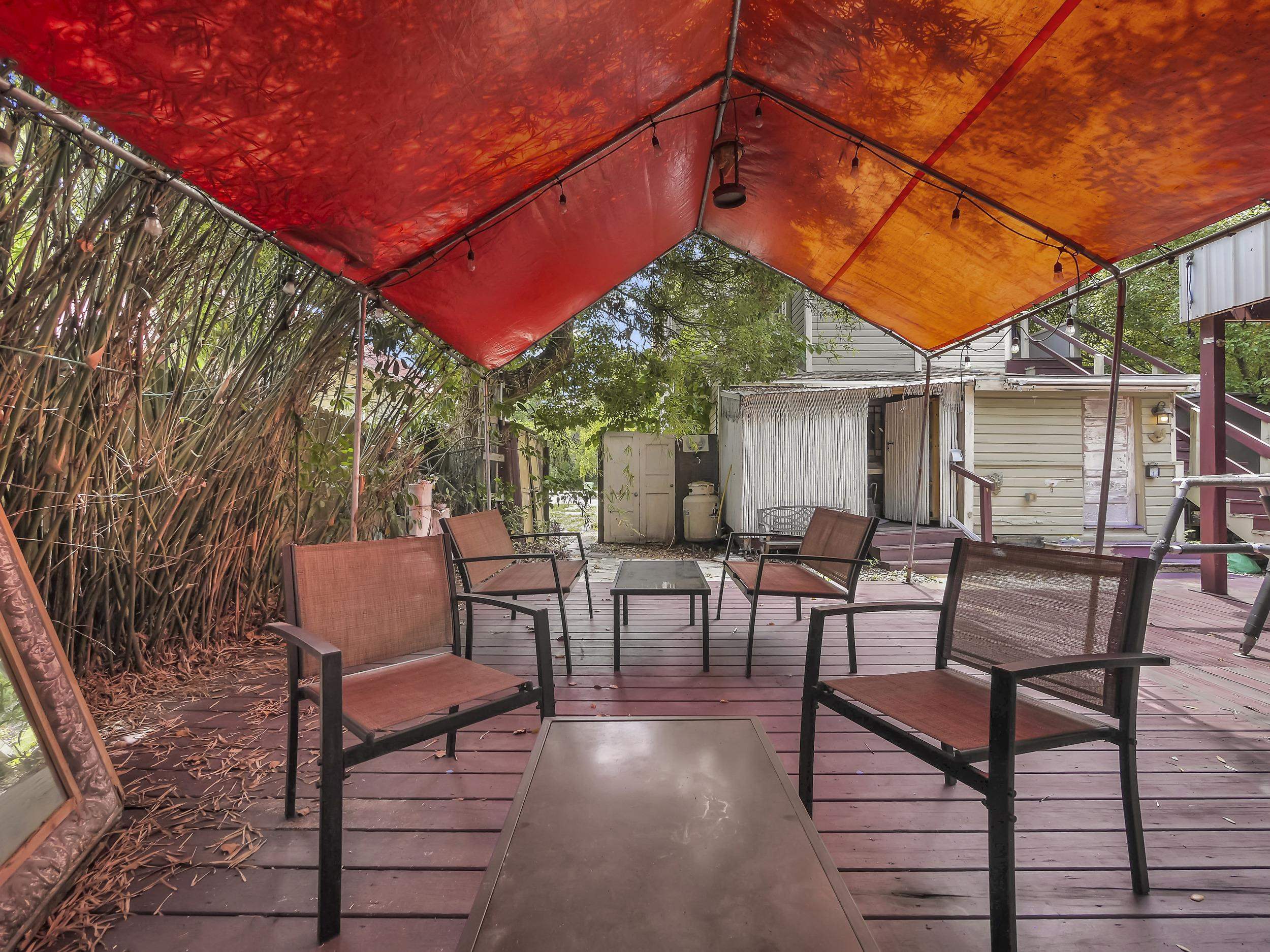 8 Davis Street St. Augustine, FL 32084 - Photo 34 of 36 a patio with tables and chairs