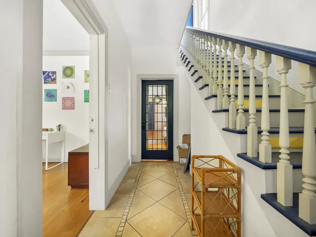 a bathroom with a bathtub and shower