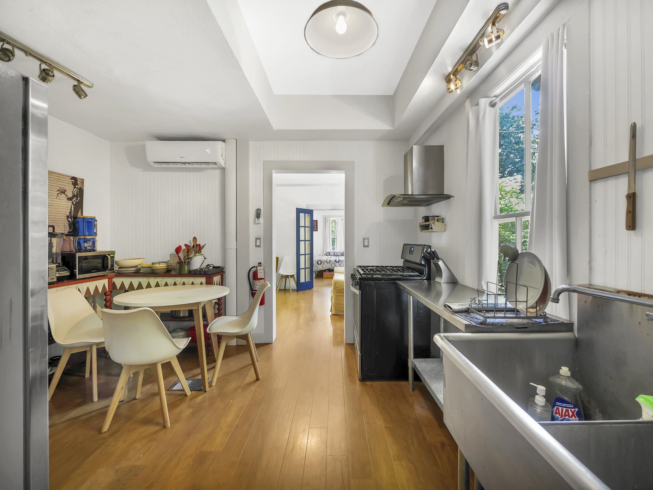 8 Davis Street St. Augustine, FL 32084 - Photo 8 of 36 a view of a dining room with furniture window and wooden floor