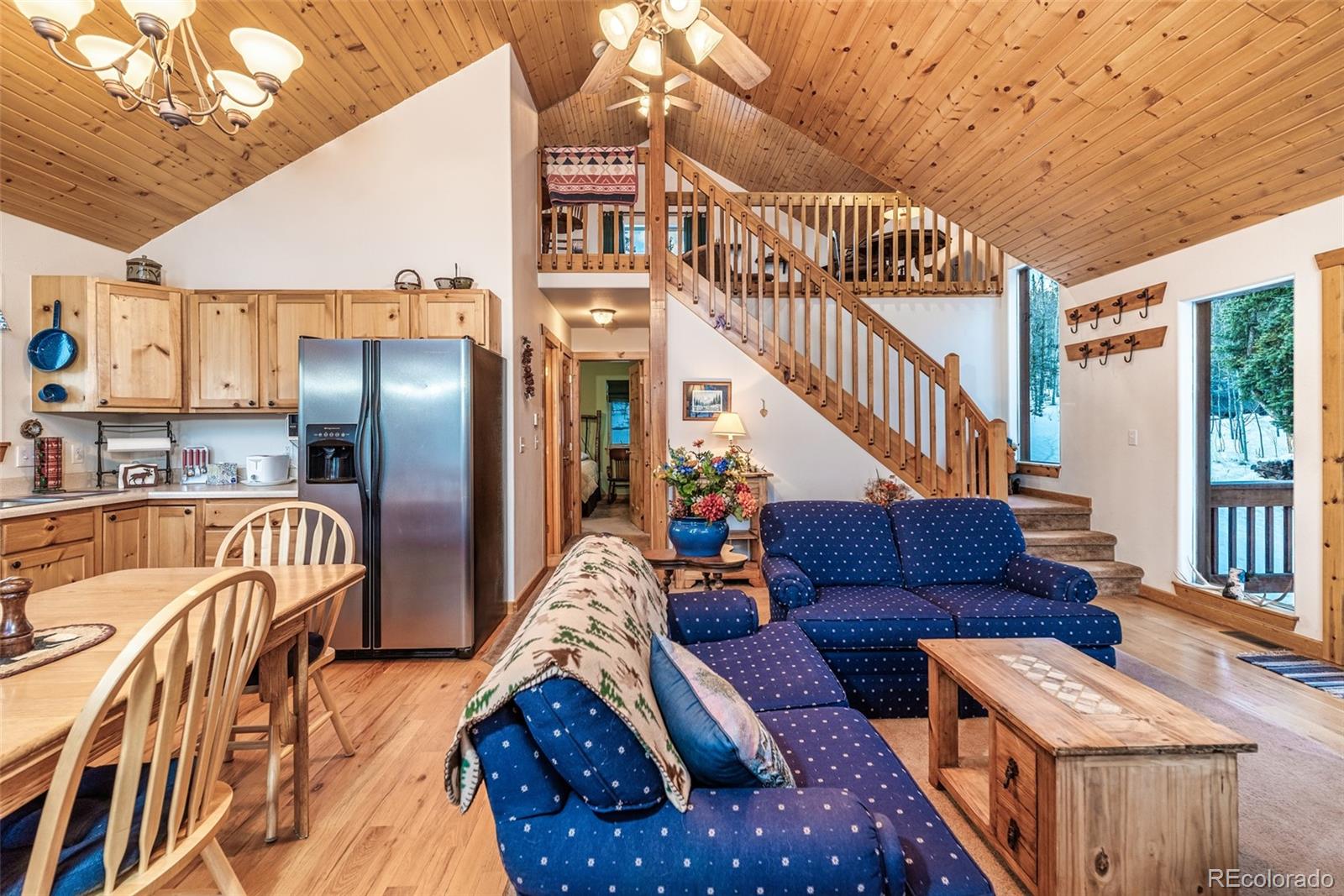 315 Haida Road Como, CO 80456 - Photo 12 of 50 a view of a livingroom with furniture and stairs