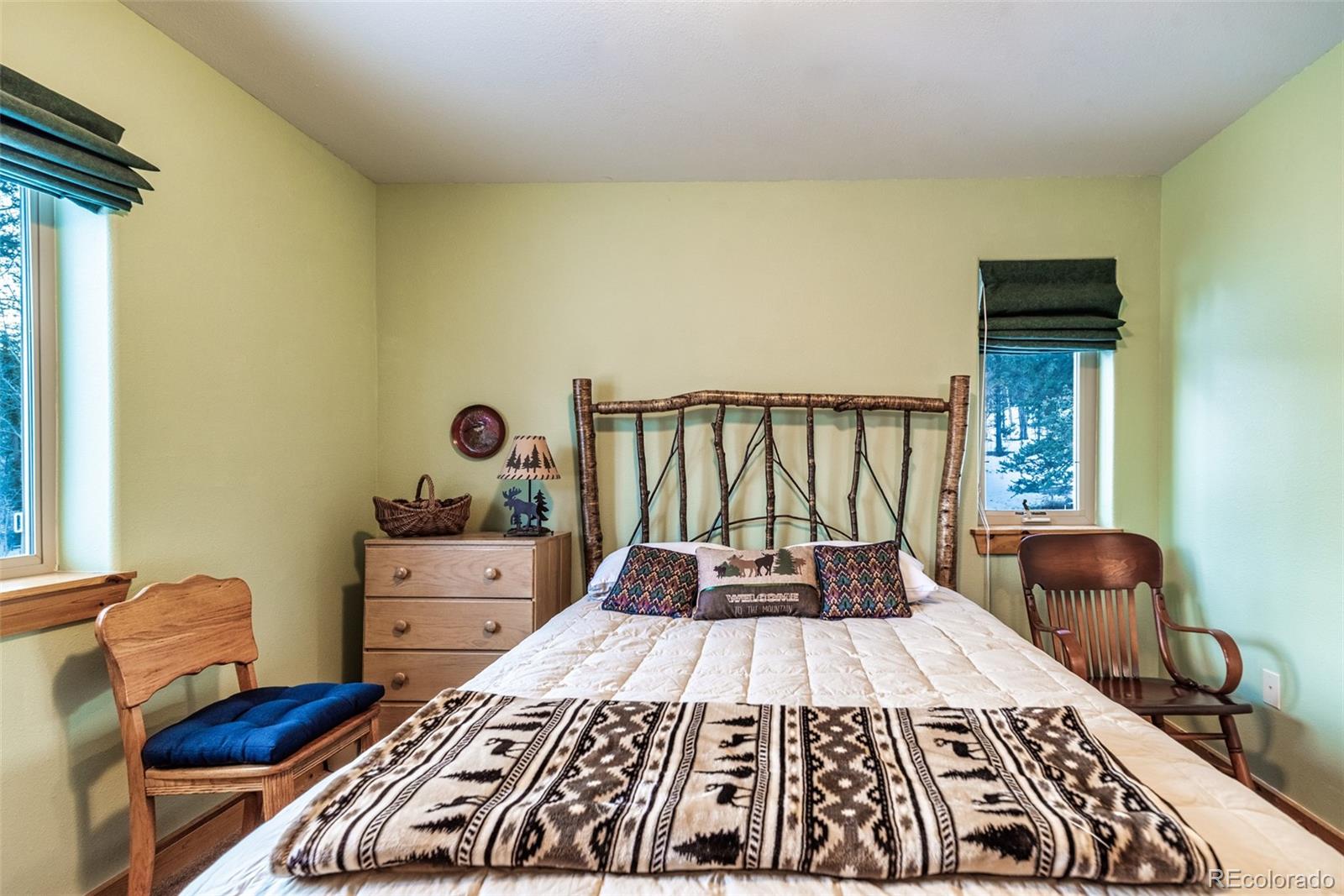 315 Haida Road Como, CO 80456 - Photo 17 of 50 a bed sitting in a bedroom next to a window