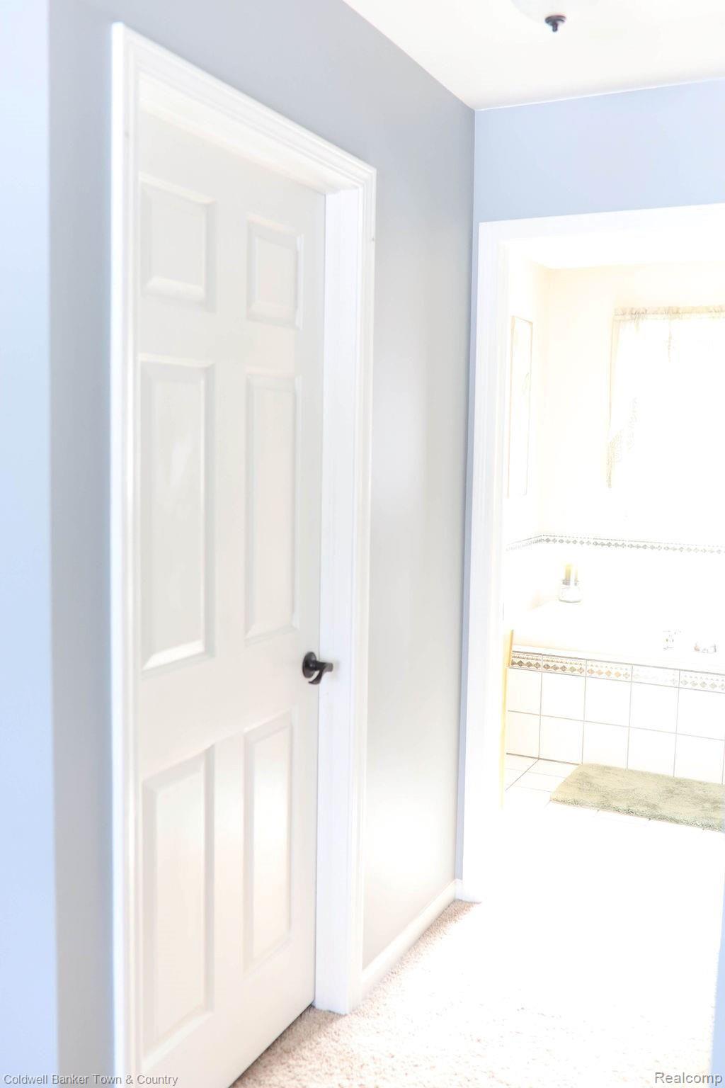 13311 Commerce Road Milford, MI 48380 - Photo 35 of 69 Master His & Her Closets into Bath
