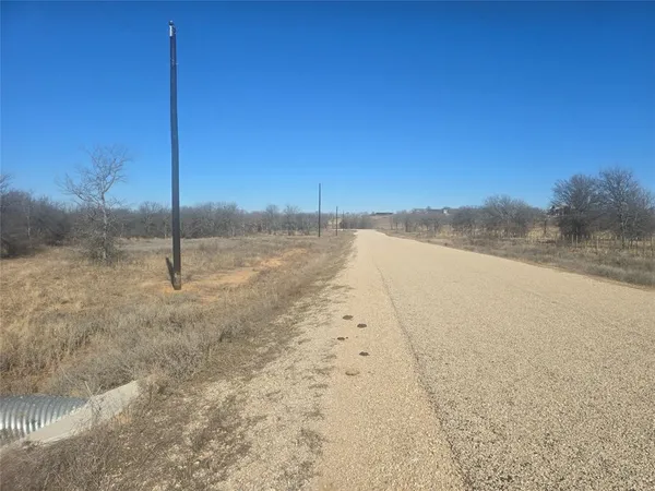 a view of a road with an ocean view