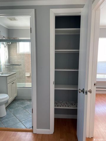 a bathroom with a toilet sink and a window