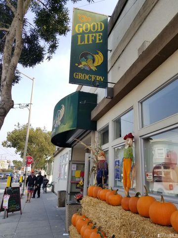a view of a building with sitting area