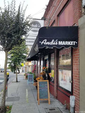 a view of a building with car parked