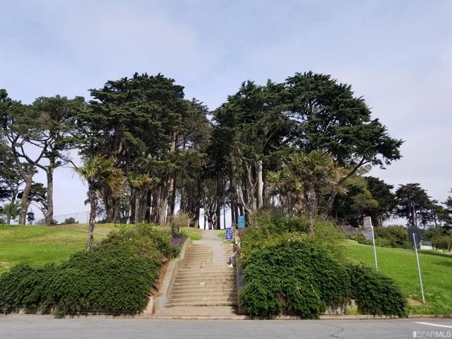 a view of a golf course with a garden