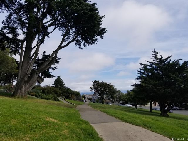 a view of a chairs and table in the patio