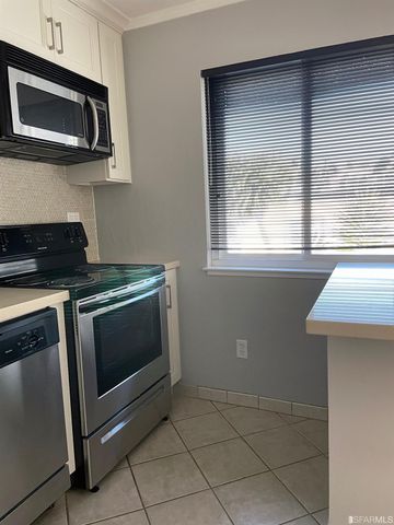 a kitchen with a stove and a microwave