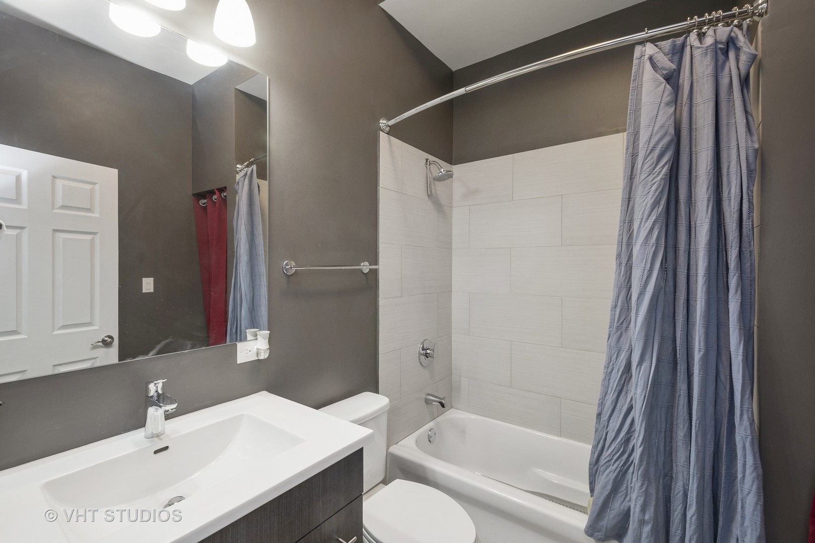 4530 South Prairie Avenue, Unit 1N Chicago, IL 60653 - Photo 8 of 11 a bathroom with a sink toilet and shower