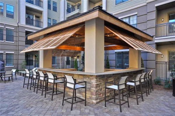 a front view of a building with outdoor seating