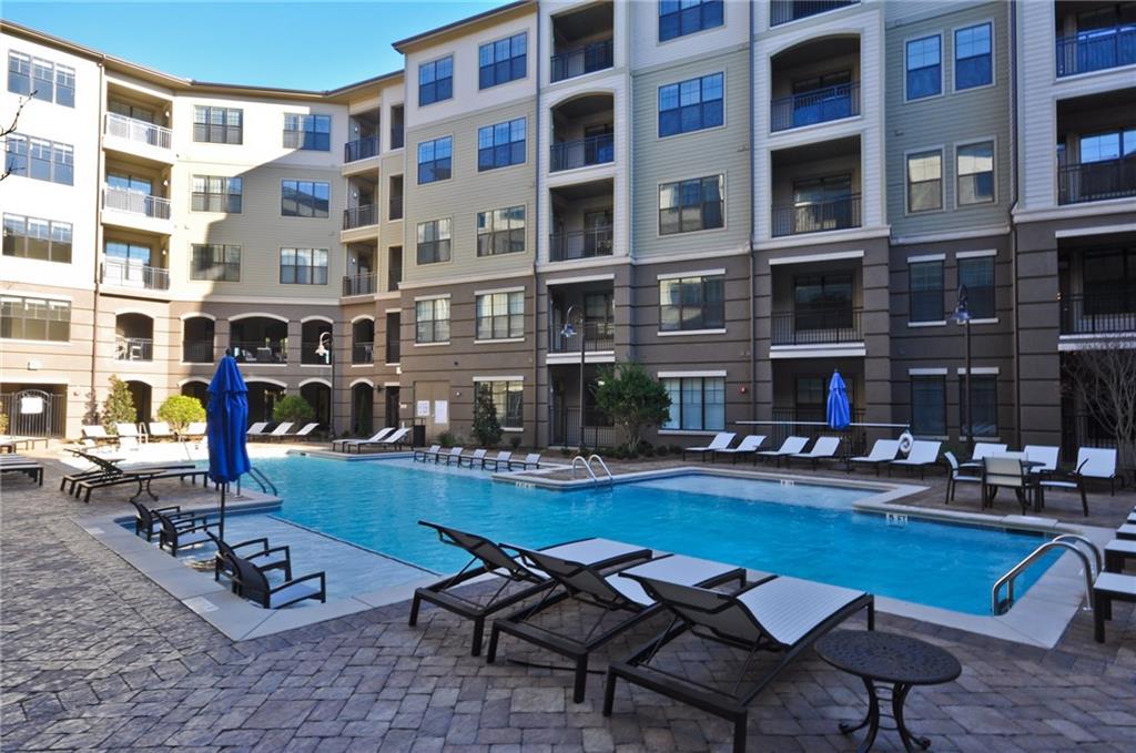 3695 Cumberland Boulevard Southeast, Unit 1129 Atlanta, GA 30339 - Photo 26 of 34 a front view of a building with outdoor seating