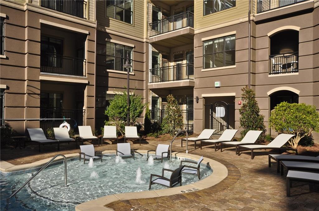 3695 Cumberland Boulevard Southeast, Unit 1129 Atlanta, GA 30339 - Photo 27 of 34 a view of a chairs and a table in the patio