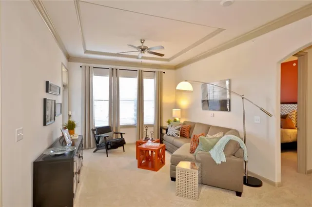 a living room with furniture fireplace and flat screen tv