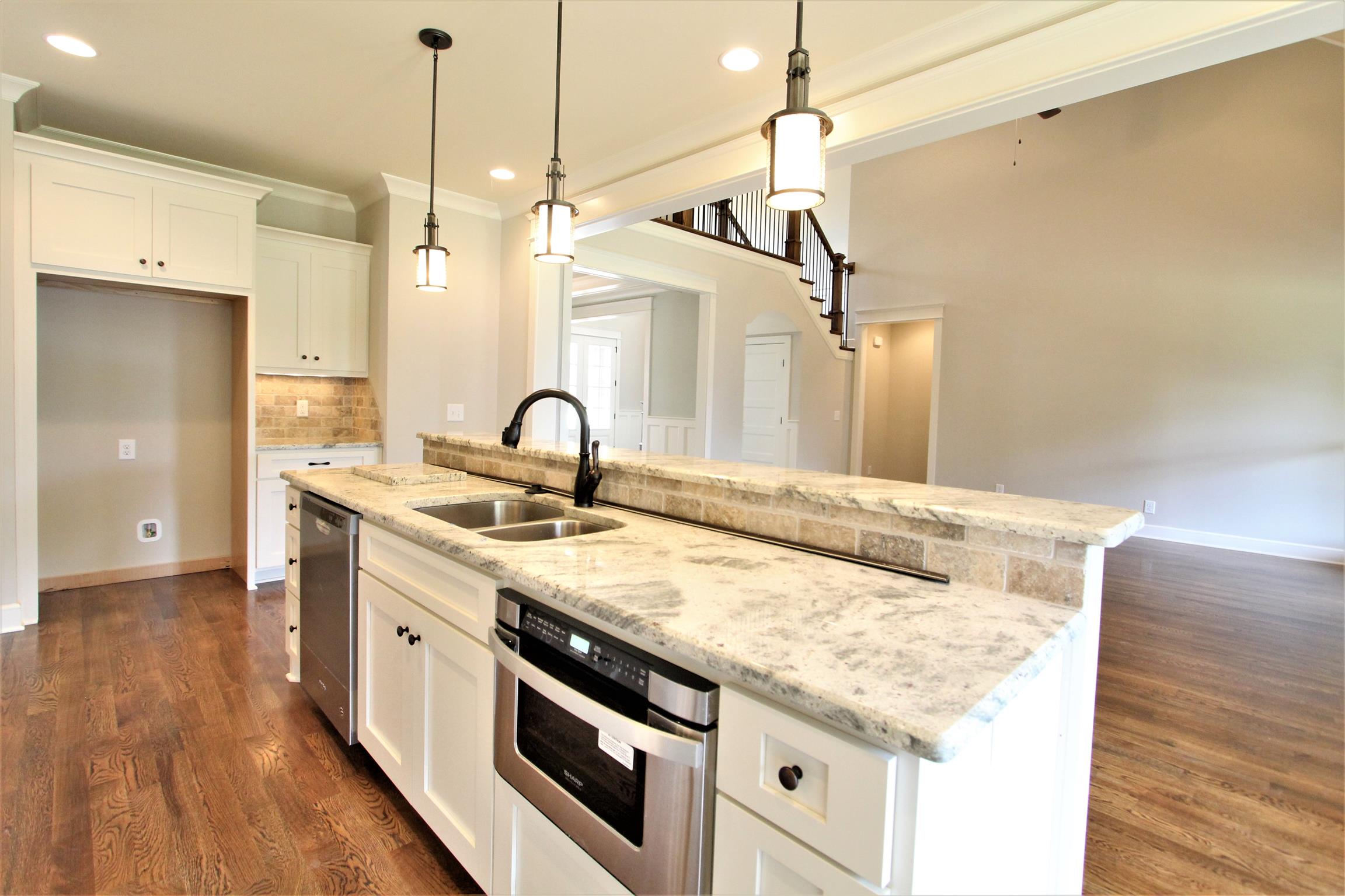 1223 Mires Road, Unit 15C Mount Juliet, TN 37122 - Photo 12 of 29 Kitchen With Large Island With Microwave Drawer And Dishwasher