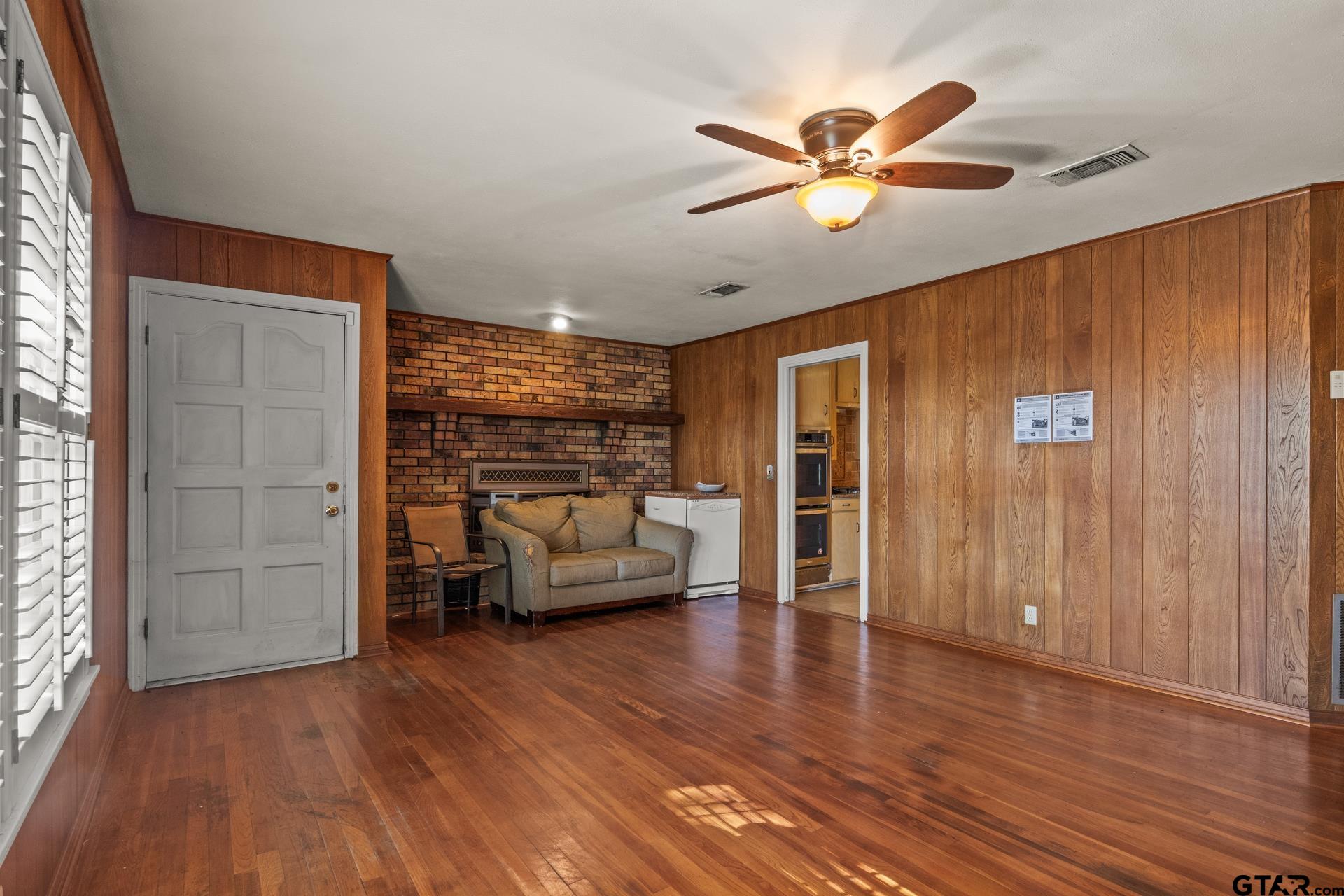 302 Smith Street Naples, TX 75568 - Photo 12 of 28 a living room with furniture and a ceiling fan