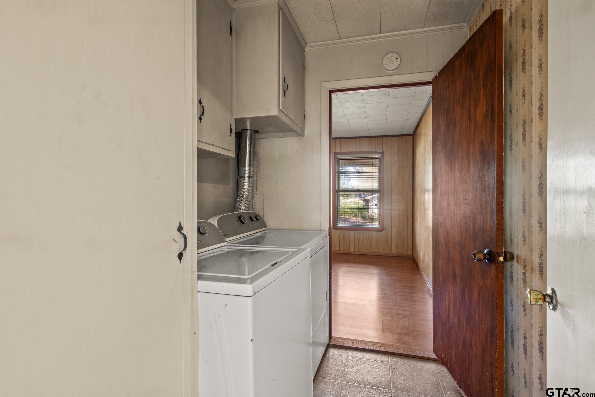 302 Smith Street Naples, TX 75568 - Photo 20 of 28 a view of hallway with stairs and wooden floor